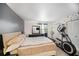 Bedroom featuring neutral walls, exercise equipment, and double closets at 12709 Raeburn Way, Tampa, FL 33624