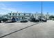 Townhome complex with ample parking, featuring well-kept landscaping and a welcoming curb appeal at 12709 Raeburn Way, Tampa, FL 33624