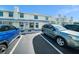 Charming townhome with well-manicured front yard, showcasing a lovely entrance and convenient parking at 12709 Raeburn Way, Tampa, FL 33624