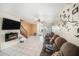 Comfortable living room featuring an electric fireplace and tile flooring at 12709 Raeburn Way, Tampa, FL 33624
