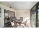 Screened patio with view of pond and outdoor seating at 12709 Raeburn Way, Tampa, FL 33624