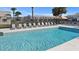 Relaxing community pool with lounge chairs and clear blue water, perfect for sunny days and refreshing swims at 12709 Raeburn Way, Tampa, FL 33624