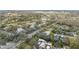 Scenic aerial view of a community featuring mature trees, a golf course, and a tranquil lake at 13502 Palmwood Ln # 13502, Tampa, FL 33618