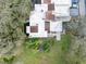 An aerial view showcasing the layout of the building's roof, trees, and the surrounding yard at 13502 Palmwood Ln # 13502, Tampa, FL 33618