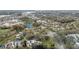 Community aerial view featuring a golf course, a distinctive blue domed building and mature tree coverage at 13502 Palmwood Ln # 13502, Tampa, FL 33618