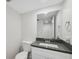 Modern bathroom with a vanity and a large mirror at 13502 Palmwood Ln # 13502, Tampa, FL 33618