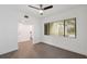Bright, airy bedroom with ceiling fan and large window overlooking the greenery outside at 13502 Palmwood Ln # 13502, Tampa, FL 33618
