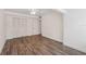 This bedroom features hard flooring, a ceiling fan and closet space for ample storage at 13502 Palmwood Ln # 13502, Tampa, FL 33618