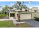 Charming two-story townhome with attached garage and vibrant landscaping at 13502 Palmwood Ln # 13502, Tampa, FL 33618