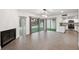 Spacious living room with a cozy fireplace and sliding doors leading to a serene backyard at 13502 Palmwood Ln # 13502, Tampa, FL 33618