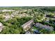 Aerial view showcasing the townhome community, pool and surrounding neighborhood at 14 Seagrape Cir, Clearwater, FL 33759