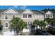 Charming townhomes with well-kept landscaping and attached garages, offering curb appeal and convenience at 14 Seagrape Cir, Clearwater, FL 33759