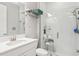 Accessible bathroom featuring a glass shower, grab bars, and easy to use faucet at 17953 Ramble On Way, Land O Lakes, FL 34638