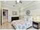 Inviting bedroom with a decorative headboard, stylish light fixtures, and neutral decor at 18014 Forest Retreat Ln, Tampa, FL 33647