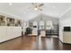 A spacious home office with high ceilings, built-in shelving, and hardwood flooring at 18014 Forest Retreat Ln, Tampa, FL 33647