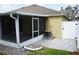 This backyard features a screened-in lanai, paver patio, and white privacy fence at 19432 Haskell Pl, Land O Lakes, FL 34638