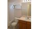 Bathroom with modern vanity, updated fixtures, and a shower-tub combo at 19432 Haskell Pl, Land O Lakes, FL 34638
