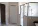 A bathroom with a glass shower enclosure and tiled floors at 19432 Haskell Pl, Land O Lakes, FL 34638