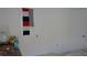 A white bedroom with a closed door and a desk that has a globe and water bottle at 19432 Haskell Pl, Land O Lakes, FL 34638