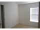 Bright bedroom with natural light from window and closet for storage at 19432 Haskell Pl, Land O Lakes, FL 34638