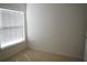 Bedroom featuring a window with natural light and neutral carpet at 19432 Haskell Pl, Land O Lakes, FL 34638