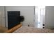 Bedroom with a bed, dresser, and a bathroom at 19432 Haskell Pl, Land O Lakes, FL 34638