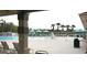 Large community pool with ample seating and palm trees, perfect for relaxing and enjoying the Florida sunshine at 19432 Haskell Pl, Land O Lakes, FL 34638
