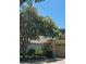 Charming single Gathering home featuring mature landscaping with flowering tree and attached garage at 19432 Haskell Pl, Land O Lakes, FL 34638