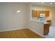 Kitchen with a breakfast bar featuring white countertops and wood cabinets at 19432 Haskell Pl, Land O Lakes, FL 34638