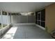 Spacious screened lanai with a concrete floor offering an ideal space for outdoor living and entertaining at 19432 Haskell Pl, Land O Lakes, FL 34638