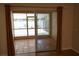 View of screened in lanai with tan tile floors, and view of the surrounding grounds at 19432 Haskell Pl, Land O Lakes, FL 34638