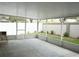 Large screened lanai with a concrete floor, offering an outdoor living space at 19432 Haskell Pl, Land O Lakes, FL 34638