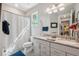 Bathroom with double vanity, granite countertop, and a shower-tub combo at 2845 Murray Pass, Odessa, FL 33556