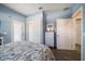 Bright bedroom with double closets, light blue walls, and access to ensuite bathroom at 30 79Th Ave, Treasure Island, FL 33706