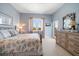 Nautical-themed bedroom with seaside inspired decor, a cozy bed, and natural light from windows at 30 79Th Ave, Treasure Island, FL 33706