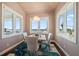 Dining room features ocean views and a modern chandelier at 30 79Th Ave, Treasure Island, FL 33706