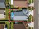 Aerial view showing the homes property line and fenced backyard with screened pool at 30715 Burleigh Dr, Wesley Chapel, FL 33543