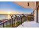 Enjoy ocean views from the balcony with metal railing overlooking the city at sunset at 3301 Bayshore Blvd # 704D, Tampa, FL 33629