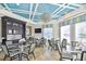 Elegant dining area with dark wood accents, decorative lighting, and comfortable seating arrangements at 34159 Astoria Cir, Wesley Chapel, FL 33545