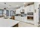 Modern kitchen showcasing stainless steel appliances, white cabinetry, and a large island perfect for entertaining at 34159 Astoria Cir, Wesley Chapel, FL 33545