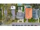Aerial view of the property, showcasing its roof, driveway and proximity to neighbors at 3419 W Empedrado St, Tampa, FL 33629