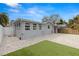 Paver patio with a patch of artificial turf in a backyard at 3419 W Empedrado St, Tampa, FL 33629