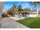 Spacious backyard featuring a screened in porch at 3419 W Empedrado St, Tampa, FL 33629