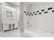 Modern bathroom featuring a tub, designer tiles, and a sleek vanity at 3419 W Empedrado St, Tampa, FL 33629