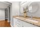 Bathroom featuring granite countertops, white cabinets, and dual sinks at 3419 W Empedrado St, Tampa, FL 33629