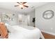 Bright bedroom featuring hardwood floors, neutral colors and a decorative mirror at 3419 W Empedrado St, Tampa, FL 33629