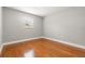 Empty bedroom with hardwood floors and a bright window at 3419 W Empedrado St, Tampa, FL 33629