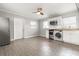 Charming kitchen featuring stainless steel appliances, tile backsplash, and open living space at 3419 W Empedrado St, Tampa, FL 33629