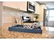 Granite countertop featuring modern appliances, white cabinets, and decorative accents at 3419 W Empedrado St, Tampa, FL 33629