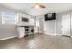 Charming kitchen featuring stainless steel appliances, tile backsplash, and open living space at 3419 W Empedrado St, Tampa, FL 33629